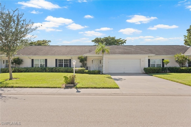 single story home featuring a front lawn and a garage