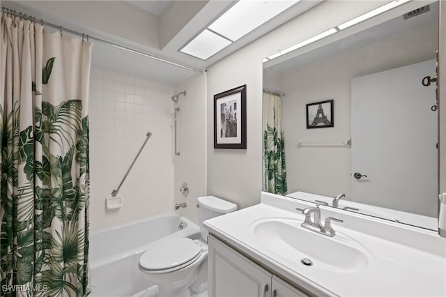 full bathroom with toilet, vanity, and shower / bath combination with curtain