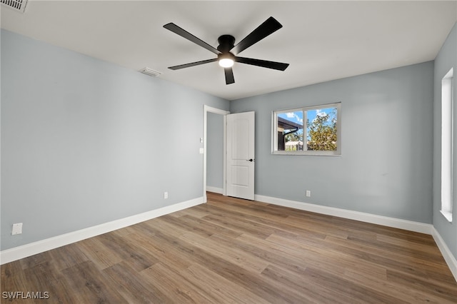 spare room with ceiling fan and light hardwood / wood-style flooring