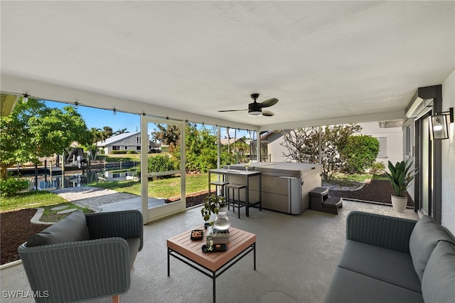 view of patio / terrace featuring outdoor lounge area, a bar, and ceiling fan