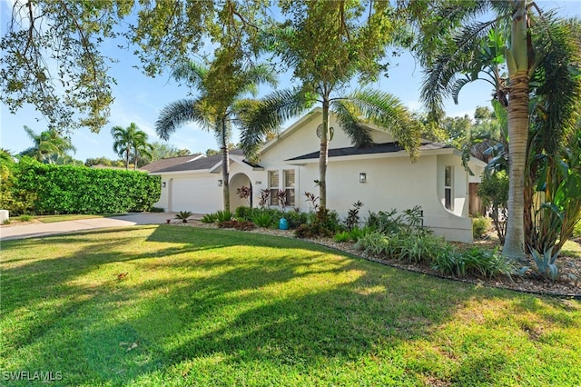 ranch-style house with a garage and a front yard