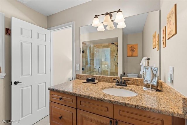 bathroom with vanity, toilet, and walk in shower