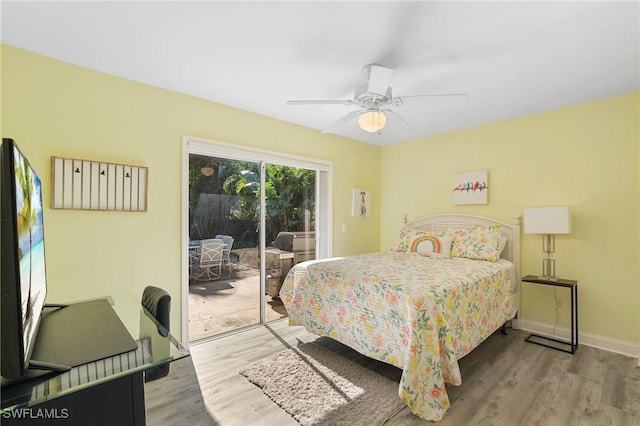 bedroom with access to outside, light hardwood / wood-style flooring, and ceiling fan