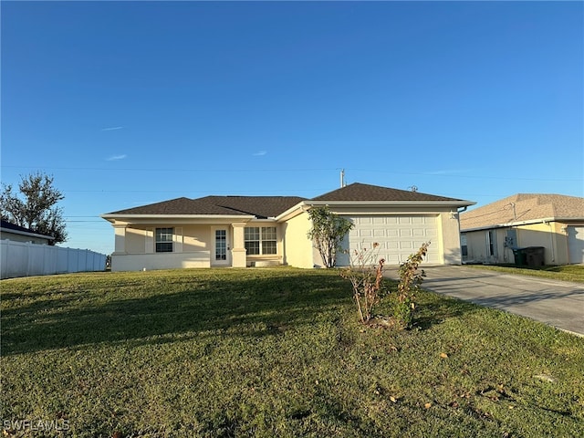 single story home featuring a garage and a front yard