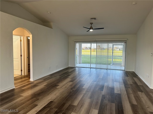 unfurnished room featuring ceiling fan, dark wood-type flooring, and lofted ceiling