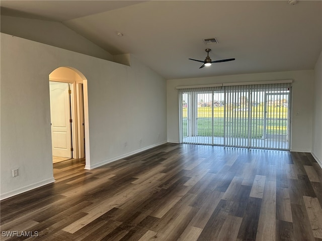 spare room with dark hardwood / wood-style floors, ceiling fan, and lofted ceiling