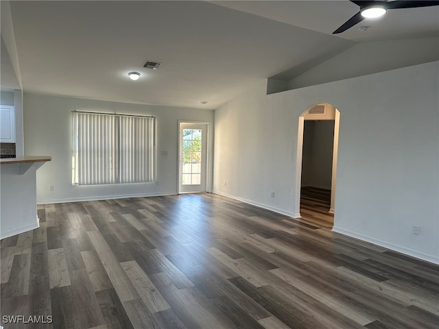 interior space with lofted ceiling, ceiling fan, and dark hardwood / wood-style floors