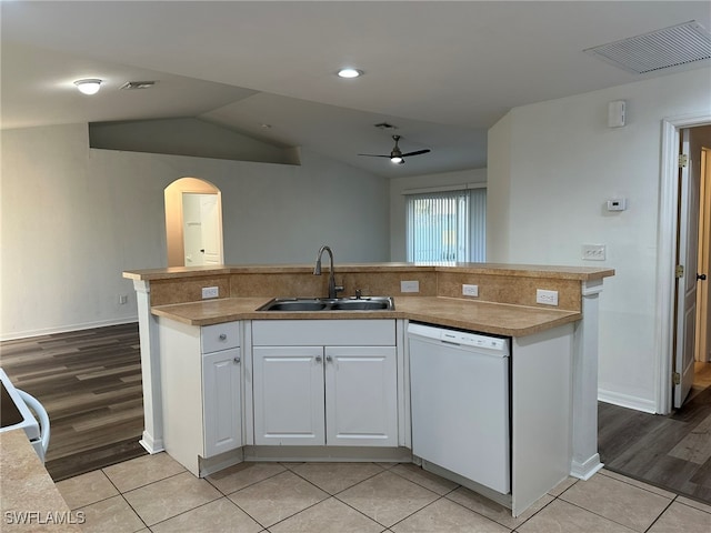 kitchen featuring white dishwasher, light hardwood / wood-style floors, white cabinetry, and sink