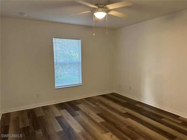 unfurnished room featuring ceiling fan and dark hardwood / wood-style floors