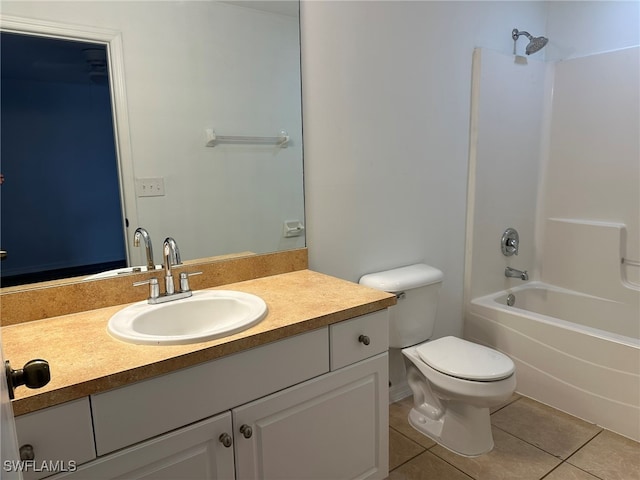 full bathroom with tile patterned floors, vanity, toilet, and shower / tub combination