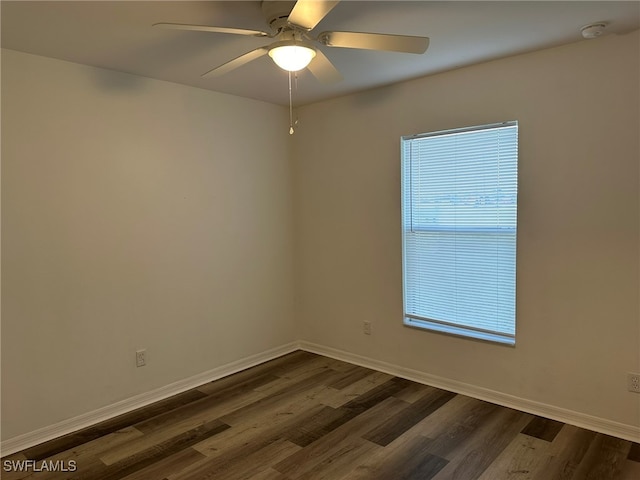 unfurnished room featuring ceiling fan and dark hardwood / wood-style floors