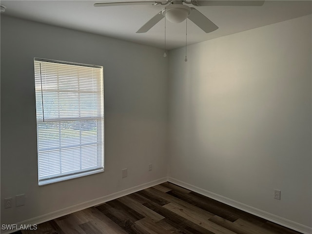 empty room featuring dark hardwood / wood-style floors and ceiling fan