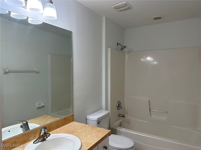 full bathroom featuring vanity, toilet, and shower / washtub combination