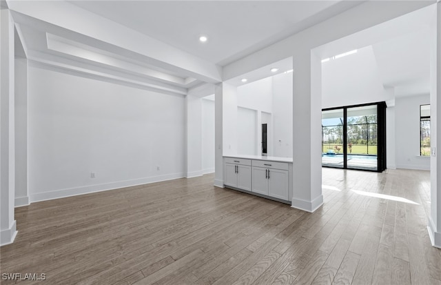 unfurnished living room featuring light hardwood / wood-style flooring