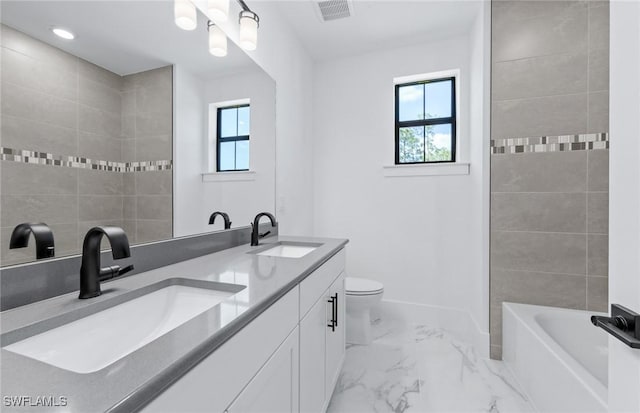 14111 Calaveras Ct, Estero, FL 33928 - bathroom with healthy amount of natural light, marble look tile flooring, double vanity, toilet, and recessed lighting