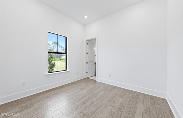 spare room with light hardwood / wood-style floors