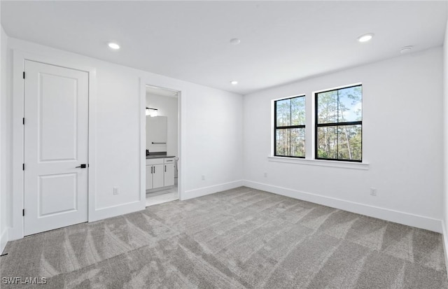 14111 Calaveras Ct, Estero, FL 33928 - unfurnished bedroom featuring carpet floors, baseboards, recessed lighting, and connected bathroom