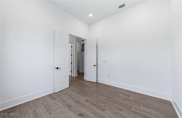 14111 Calaveras Ct, Estero, FL 33928 - spare room featuring wood finished floors and baseboards