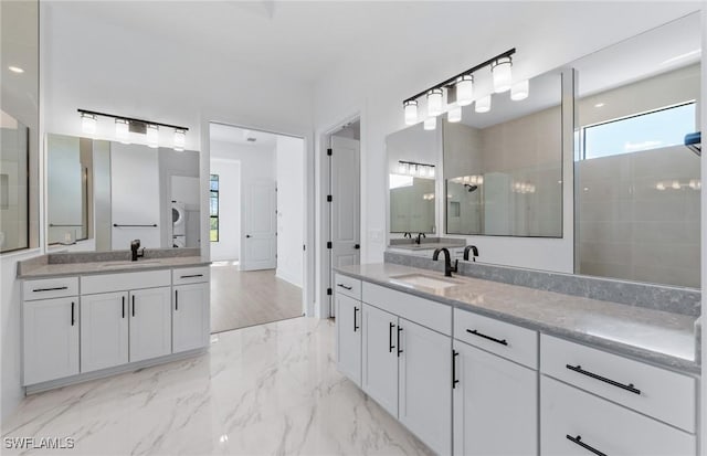 14111 Calaveras Ct, Estero, FL 33928 - bathroom with two vanities, marble finish flooring, and a tile shower