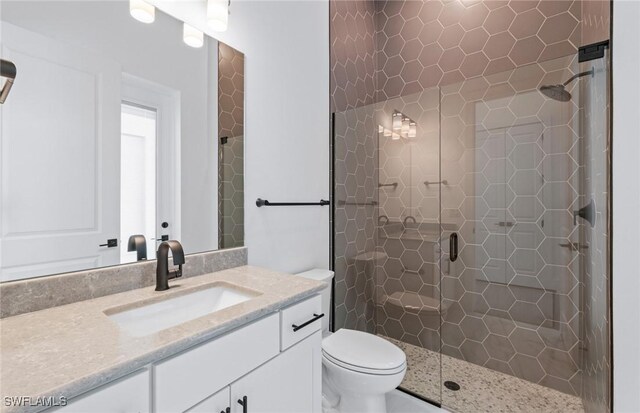 14111 Calaveras Ct, Estero, FL 33928 - full bath with vanity, a stall shower, and toilet