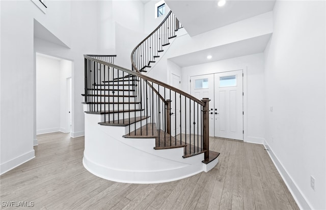 foyer entrance with light hardwood / wood-style flooring