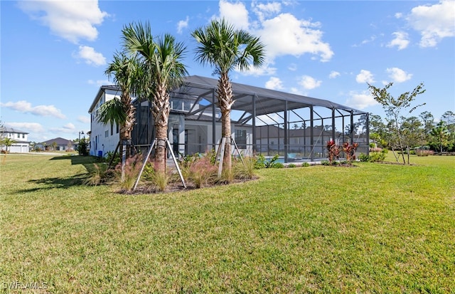 view of yard featuring a pool and a lanai