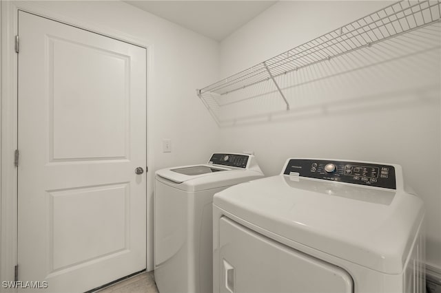 washroom featuring washer and dryer