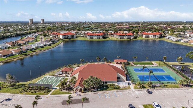 birds eye view of property featuring a water view