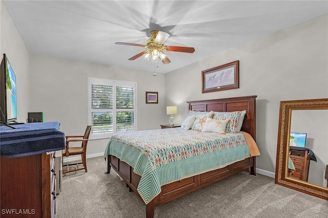 bedroom with ceiling fan and light colored carpet