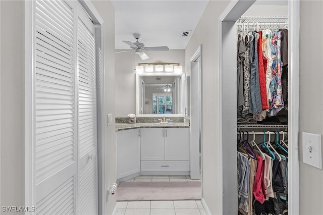 bathroom featuring vanity, tile patterned floors, and ceiling fan