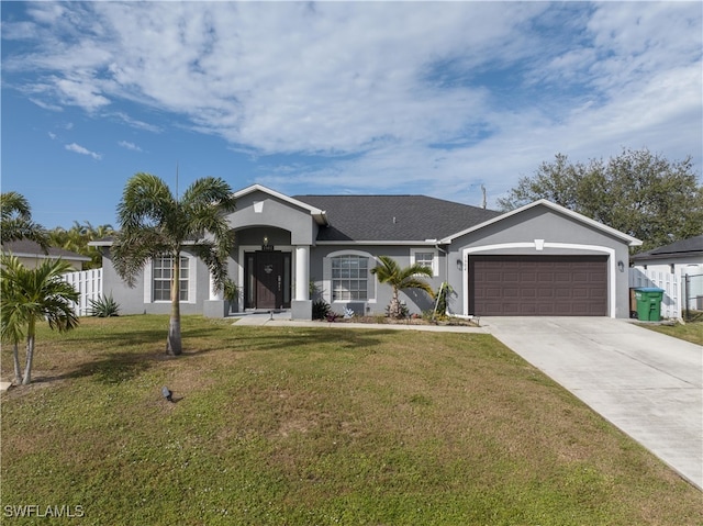 single story home featuring a garage and a front lawn