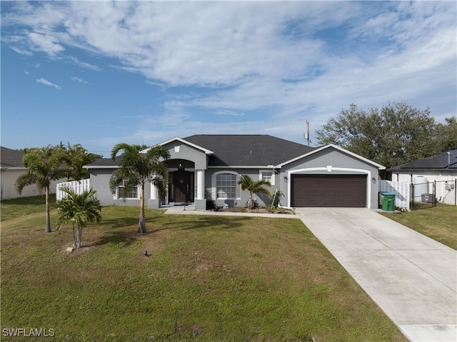 ranch-style home with a front yard and a garage