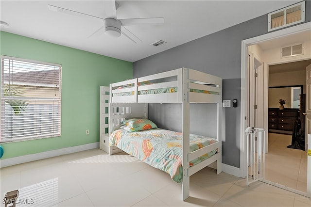 bedroom with tile patterned floors and ceiling fan