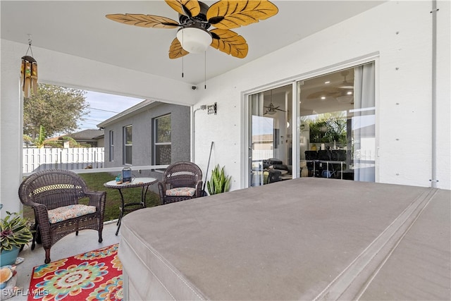 exterior space featuring ceiling fan