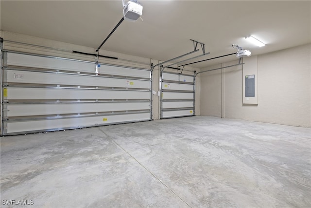 garage with electric panel and a garage door opener