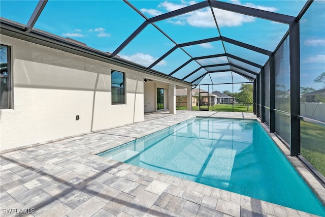 view of pool featuring a lanai and a patio