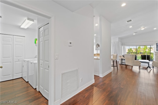 hall featuring visible vents, separate washer and dryer, wood finished floors, and recessed lighting