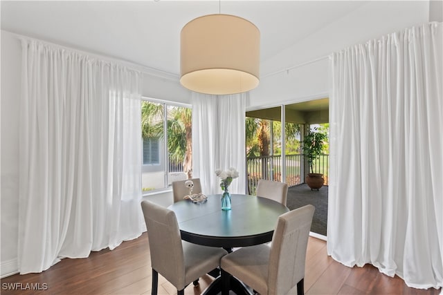 dining area with dark wood finished floors