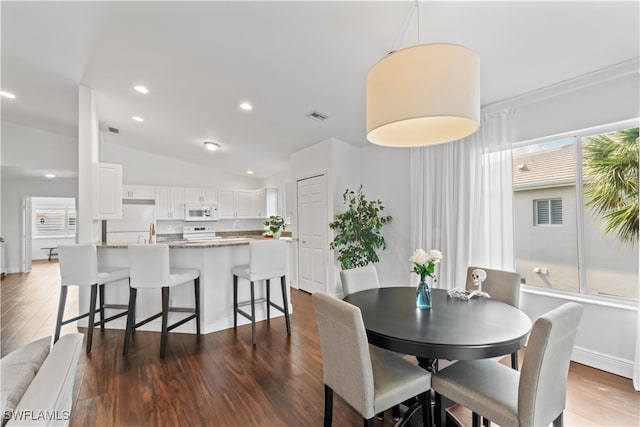 dining area featuring recessed lighting, visible vents, baseboards, vaulted ceiling, and dark wood-style floors