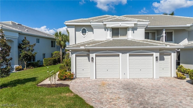 garage featuring decorative driveway