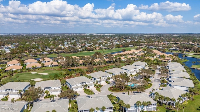 birds eye view of property featuring a water view, a residential view, and golf course view