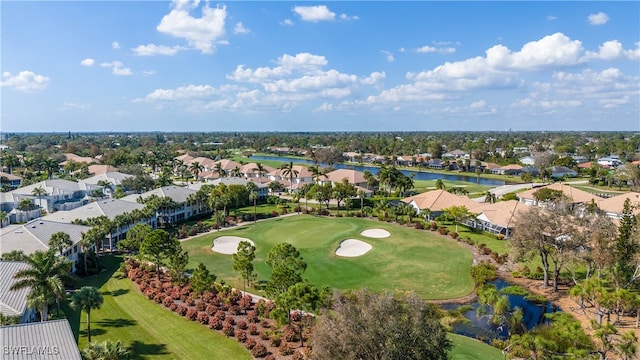 aerial view with a residential view, a water view, and golf course view