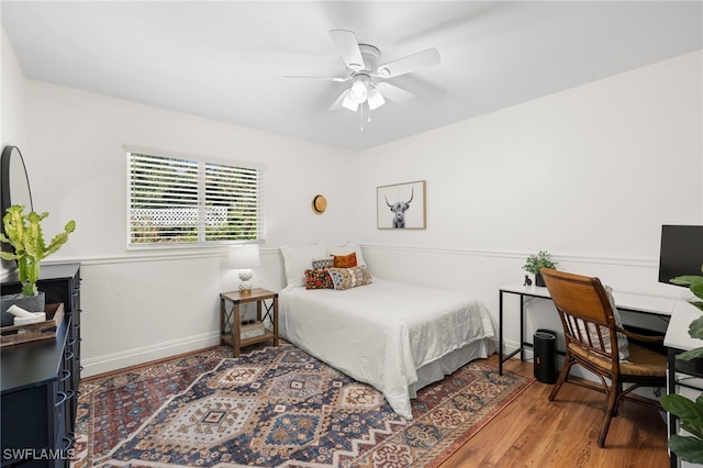 bedroom featuring hardwood / wood-style flooring and ceiling fan