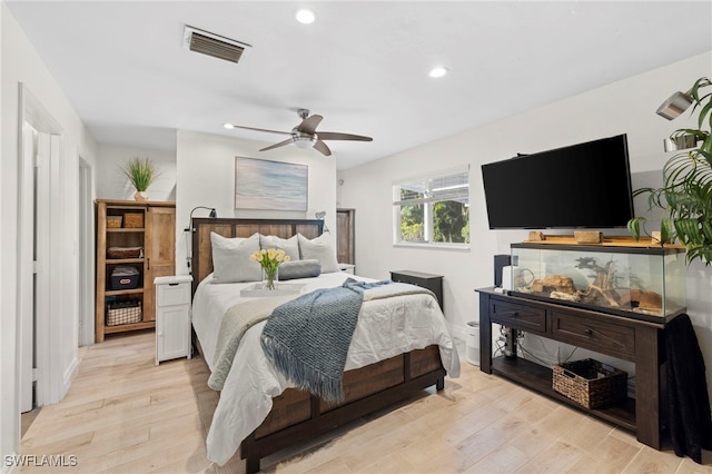 bedroom featuring ceiling fan and light hardwood / wood-style floors