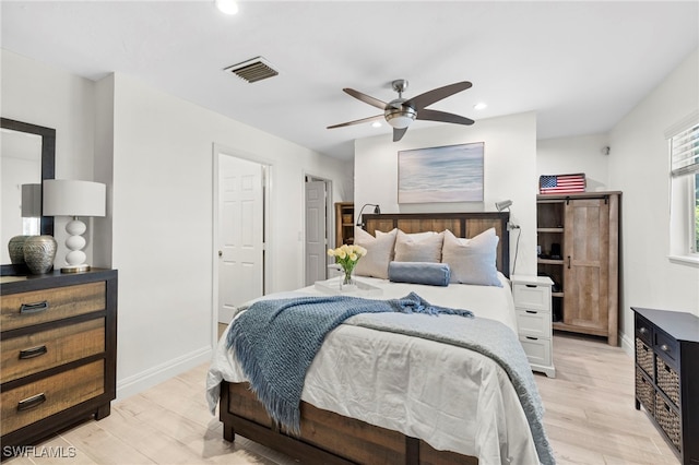 bedroom featuring ceiling fan and light hardwood / wood-style floors