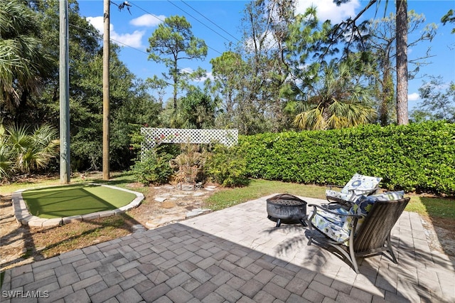 view of patio / terrace with a fire pit