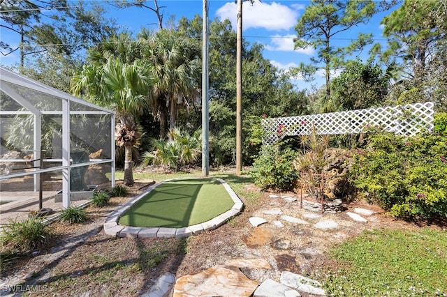 view of yard featuring glass enclosure