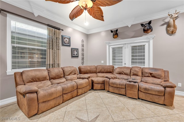 living room with light tile patterned floors, ceiling fan, and crown molding