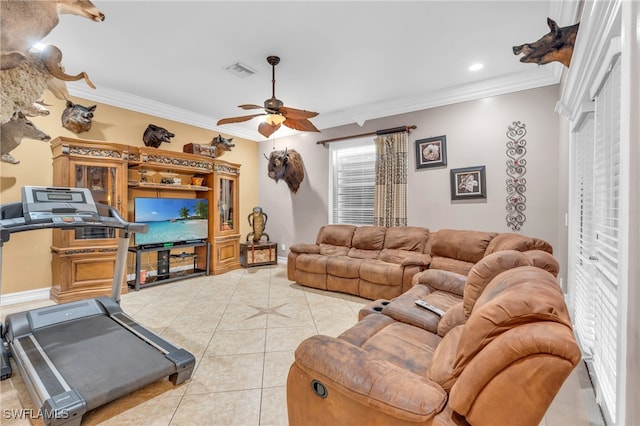 tiled living room with ceiling fan and crown molding