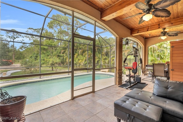 exterior space featuring a patio, ceiling fan, and a lanai